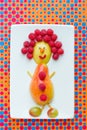 Food art idea for kids - pear and raspberry funny man Royalty Free Stock Photo