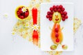 Food art idea for kids - pear and raspberry funny man Royalty Free Stock Photo