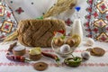 Food background with artisan bread, a bottle of milk, eggs, butter, salt, pepper, garlic, cookies and wheat ears Royalty Free Stock Photo