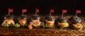 Food background of assortment of black hamburger on wooden board, selective focused