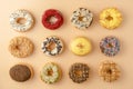 Assortment of donuts on orange background