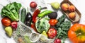 Food background banner. Seasonal vegetables on a marble background - kale cabbage, zucchini, eggplant, pepper, cauliflower, tomato