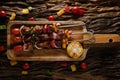 Food background of BBQ barbeque pork kebab with tomato pineapple red onion and sweet pepper served on wooden plate on wooden table Royalty Free Stock Photo