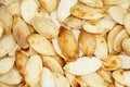 Food background - big unshelled roasted pumpkin seeds