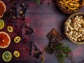 Food background with christmas spices, dried apples, nuts, citrus fruits, cydonia, cranberries, raisin, and baking dish on wooden Royalty Free Stock Photo