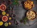 Food background with christmas spices, dried apples, nuts, citrus fruits, cydonia, cranberries, raisin, and baking dish on wooden Royalty Free Stock Photo