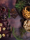 Food background with christmas spices, dried apples, nuts, citrus fruits, cydonia, cranberries, raisin, and baking dish on wooden Royalty Free Stock Photo