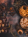 Food background with christmas spices, dried apples, nuts, citrus fruits, cydonia, cranberries, raisin, and baking dish on wooden Royalty Free Stock Photo