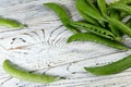 Food background. Close-up of a bunch of green pea pods on a wooden table. Royalty Free Stock Photo