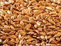 Food background.Closeup flax seeds illuminated with yellow light