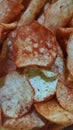 Food background full of spicy potato chips, top view Royalty Free Stock Photo