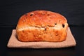 Food background Organic French whole wheat Raisin bread on black background plate