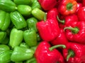 Pile of ripe red and green bell pepper close-up