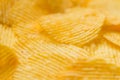 Food background potato chips rippled macro Royalty Free Stock Photo