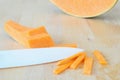 Food background, pumpkin and ceramic white knife Royalty Free Stock Photo