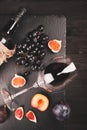 Food background with red wine, figs, grapes and cheese Royalty Free Stock Photo