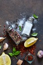 Food background - spices.A set of spices: chili, paprika, garlic, salt, lemon, rosemary, thyme and olive oil on a concrete Royalty Free Stock Photo