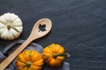 Food background with spoon and pumpkins, autumn cooking concept