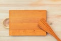 Food background. Top view of empty wooden cutting board and spatula on planks vintage table with copy space Royalty Free Stock Photo