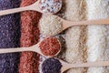 Food background with top view of five rows of rice in a wooden spoon