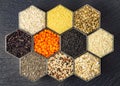 Food background of various cereals and grains in hexagonal shaped honeycomb jars