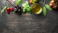 Food background with vegetables, herbs and condiment. Greek black olives, fresh basil, sage, rosemary, tomato, peppers Royalty Free Stock Photo