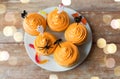 Halloween party cupcakes with decorations on plate Royalty Free Stock Photo