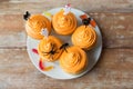 Halloween party cupcakes with decorations on plate Royalty Free Stock Photo