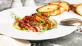 Food banner. Close up pea soup in a white bowl. Delicious vegetable soup with green peas, carrots and fried bacon Royalty Free Stock Photo