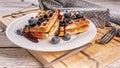 Food banner. Close-up viennese waffles with blueberries and jam. Sweet dessert. Homemade baking