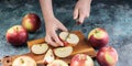 Food banner. Girl hands knife cut an apple. Blue concrete background