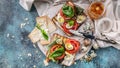 Food banner italian toasts with cheese, tomatoes, basil, quail eggs. Ideas for a tasty and healthy breakfast. Top view