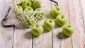 Food banner. Organic green apples and cotton string mesh bag on a wooden table Royalty Free Stock Photo