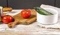 Food banner. Ripe tomatoes on a cutting board. Chopping wooden boards and utensils. Fresh and tasty vegetables. Kitchen