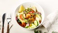Food banner summer salad with fresh vegetables, fried shrimps, cheese and herbs. Seasonal vegetables, seafood and goat cheese. Royalty Free Stock Photo