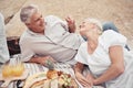 Food, beach and picnic senior couple dating or on romantic honeymoon date with fruit, snack and drink. Happy, love and Royalty Free Stock Photo