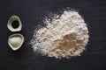 Food blog baking ingredients flour and sugar on dark table