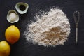 Food blog making a lemon pie flour lemons on dark surface Royalty Free Stock Photo