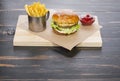 Food on the board: cheeseburger, french fries