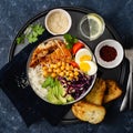 Food bowl Buddha bowl Rice chickpeas chicken breast eggs vegetables top view