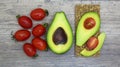 Food, Breakfast, sandwich. Tomatoes, avocado, bread, toast. Ingredients, cook. Vegan, vegetarian, proper nutrition Royalty Free Stock Photo