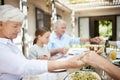 Food brings us together, love keeps us together. a family saying grace while sitting together at the dining table.