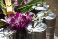 Food carriers offering to monks and orchids Royalty Free Stock Photo