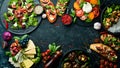 Food: cheese, figs, mushrooms, meat and vegetables. European and Asian cuisine. Healthy food on a black stone background. Top view