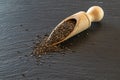 Food chia seeds in wooden spoon. Healthy pile flax superfood on black background. Salvia hispanica antioxidant grains on Royalty Free Stock Photo