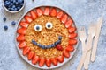 Food for children. Funny sun with a smile