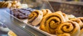 Food - Cinnamon rolls and brownie in a pastry shop.