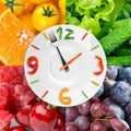 Food clock with fresh fruits and vegetables Royalty Free Stock Photo