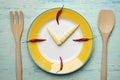 Food clock. Healthy food concept on blue or green background Royalty Free Stock Photo