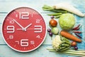 Food clock. Healthy food concept on wooden table Royalty Free Stock Photo